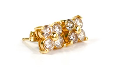 Lot 57 - A pair of 18ct gold and diamond flowerhead...