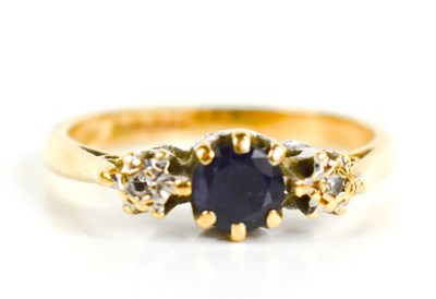 Lot 91 - An 18ct gold, diamond and sapphire ring, the...