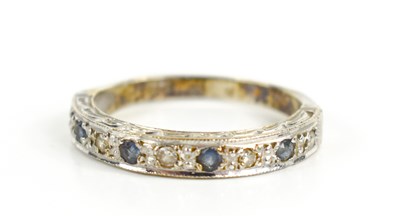 Lot 129 - A 9ct gold, diamond and sapphire half hoop...