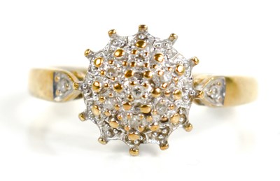 Lot 156 - A 9ct gold and diamond cluster ring, of raised...