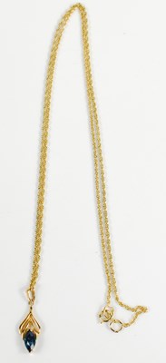 Lot 256 - A 9ct gold and blue spinel pendant necklace,...