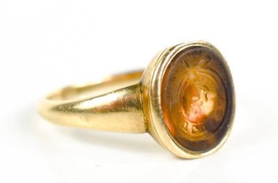 Lot 194 - A gold seal ring, the oval semi-precious stone...