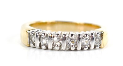 Lot 41 - A yellow metal and paste ring, the six stones...