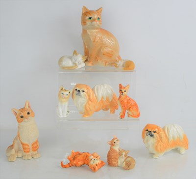 Lot 130 - A group of ceramic cat figurines to include...