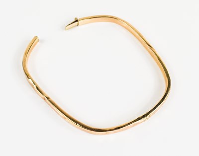 Lot 114 - A 9ct gold bangle, of curved rectangular form,...
