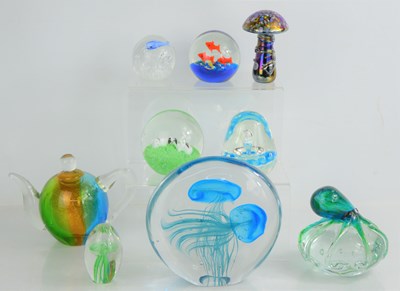 Lot 153 - A group of glass paperweights to include a...