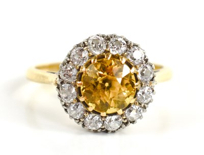 Lot 218 - An 18ct gold, yellow sapphire and diamond ring,...
