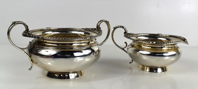 Lot 308 - An Edwardian silver sugar bowl and cream jug,...