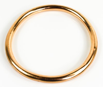 Lot 219 - A 9ct gold bangle, rounded hollow form, 8cm...