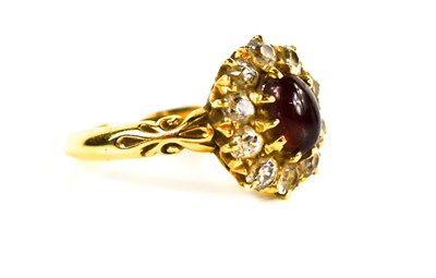 Lot 10 - An 18ct gold, ruby and diamond ring, the oval...