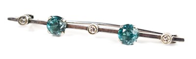 Lot 1 - A white metal, diamond and blue topaz bar...