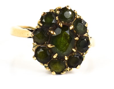 Lot 157 - A 9ct gold and green sapphire flowerhead ring,...