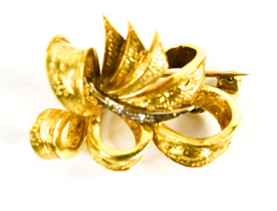 Lot 17 - A gold and diamond brooch in the form of a...