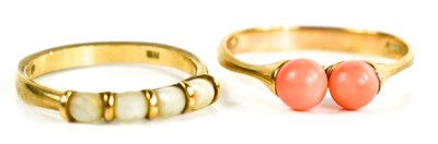 Lot 31 - Two 9ct gold rings; one set with twin coral...