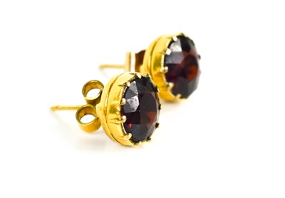 Lot 12 - A pair of 9ct gold and garnet stud earrings,...