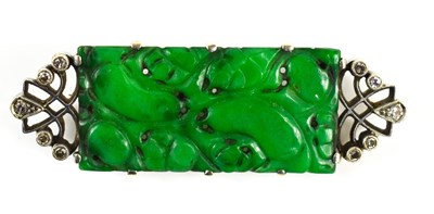 Lot 3 - A 9ct white gold, jade and diamond brooch, the...