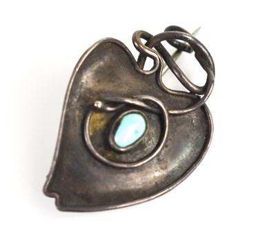 Lot 51 - A white metal Art Nouveau brooch in the form...