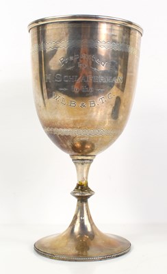 Lot 341 - A silver presentation trophy raised on a...