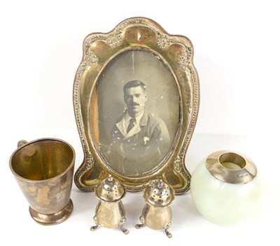 Lot 343 - A group of silver to include a small mug with...