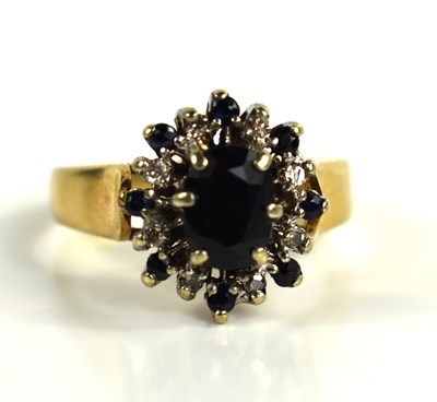 Lot 70 - A 9ct gold, diamond and sapphire cluster ring,...