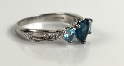 Lot 66 - A 9ct gold and three stone heart shaped cut...