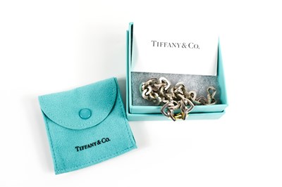 Lot 76 - A Tiffany & Co. heart chain link bracelet,...