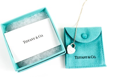 Lot 71 - A Tiffany & Co. silver heart lock pendant...