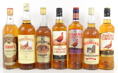 Lot 351 - A group of whisky to include four bottles of...