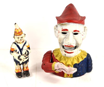 Lot 305 - Two cast iron novelty money banks in the form...