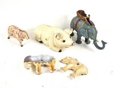 Lot 311 - A group of four vintage cast iron money banks,...