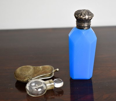 Lot 111 - A Victorian white metal and blue glass scent...