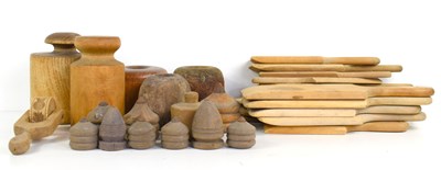 Lot 202 - A group of treen to include spinning tops,...