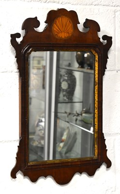 Lot 316 - A Georgian fret cut wall mirror with inlaid...