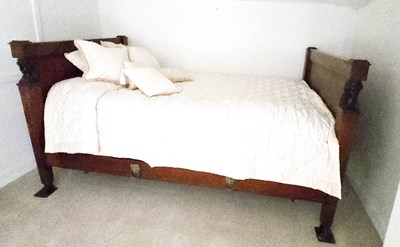 Lot 385 - A Regency period mahogany and rosewood bed,...