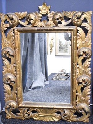 Lot 318 - A 20th century carved wooden and gilded wall...