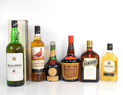 Lot 346 - A group of alcohol to include Black & White...