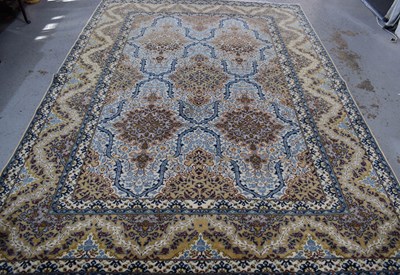 Lot 331 - A large Asian wool rug, with cream ground, and...