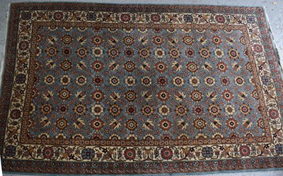 Lot 328 - A Middle Eastern wool rug with floral pattern,...