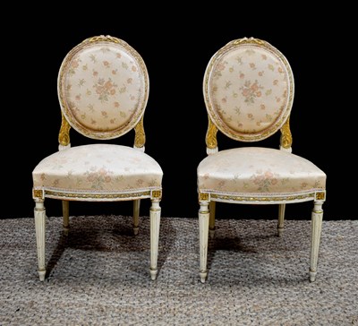 Lot 361 - A pair of French painted armchairs, with oval...