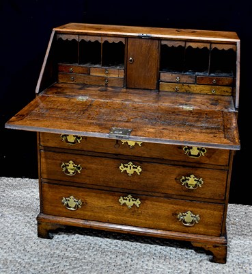 Lot 362 - A 19th century oak bureau, the fall front...