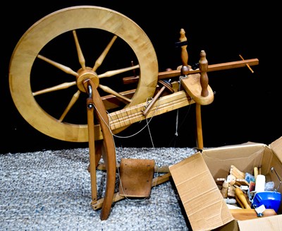 Lot 342 - A modern wooden spinning wheel with accessories.