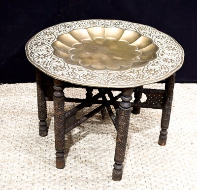 Lot 344 - An Anglo-Indian brass top table with carved...