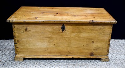Lot 365 - An antique pine blanket chest with candle box...