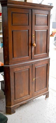 Lot 342A - An early 19th century oak corner cupboard,...