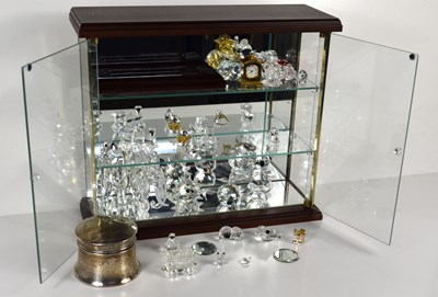 Lot 263 - A glass display cabinet together with a glass...
