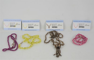 Lot 260 - Four beaded necklaces to include ruby, smoky...