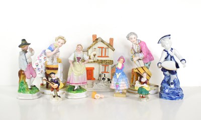 Lot 260 - A group of porcelain figures to include a...