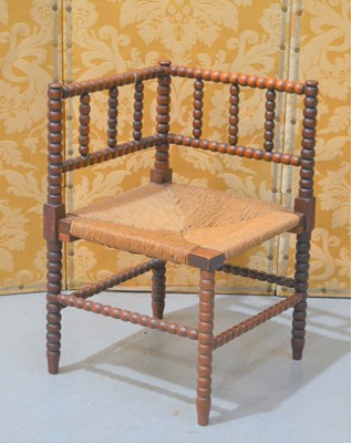 Lot 375 - A late 19th century bobbin turned oak corner...