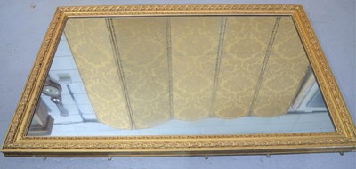 Lot 368 - A large gilt wood wall mirror with floral and...