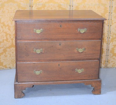 Lot 386 - An early 19th century oak chest of three...